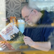 Illustration for article titled GOOD LORD, the Photos of Meghan Markle's Father Reading a Book at Starbucks Are FAKE!